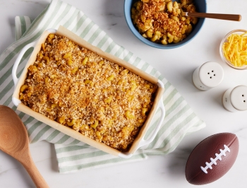 vegan mac and cheese in a casserole dish lined with unbleached parchment paper