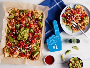 vegan BBQ Jackfruit nachos on a sheet of Reynolds unbleached parchment paper