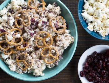 Sweet popcorn and pretzel snack mix in a bowl