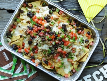 Chicken nachos in a disposable aluminum pan