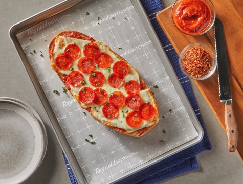 flatbread pizza on parchment paper