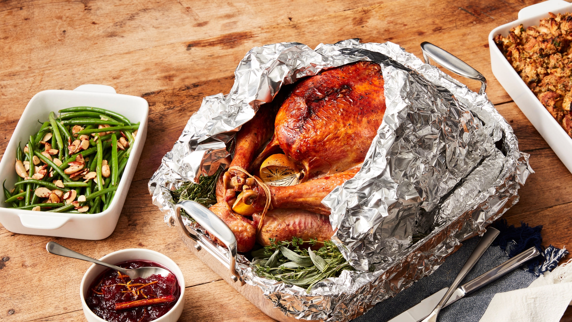 Cooked turkey partially covered in foil