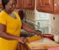 A woman unrolling a wax paper on a table